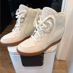 Sorel Women's White and Tan High-Top winter wedge boots.